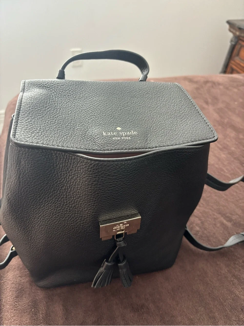 kate spade Black Pebbled Leather Backpack with Tassel Detail